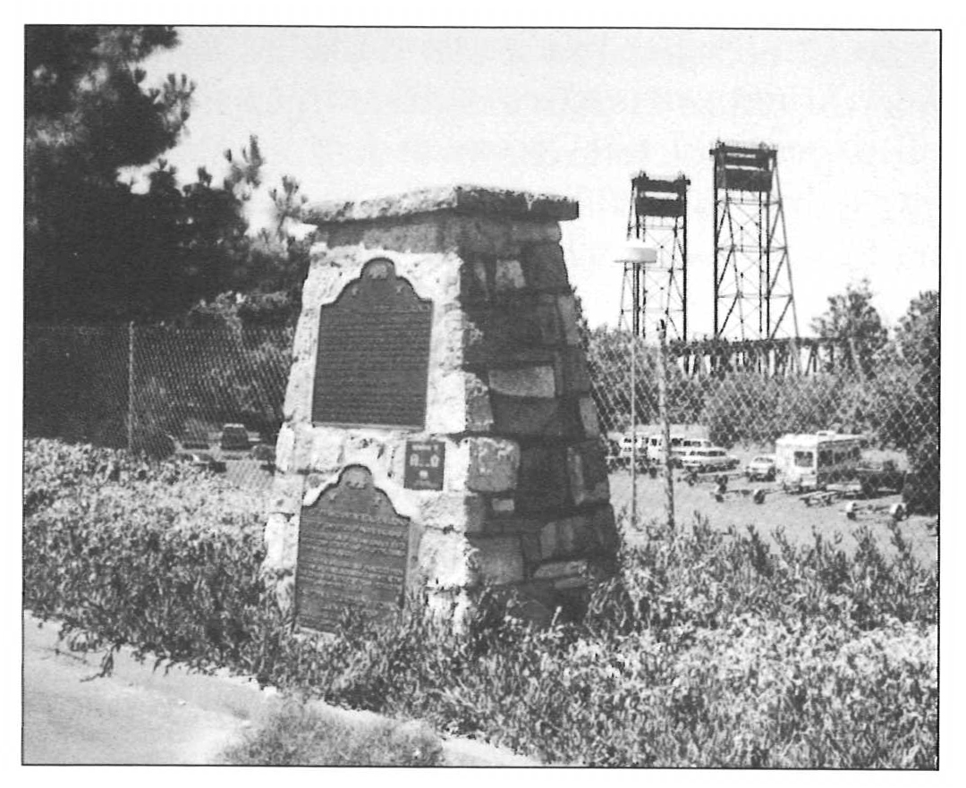 1948 Comet monument with transcontinental railroad bridge in background