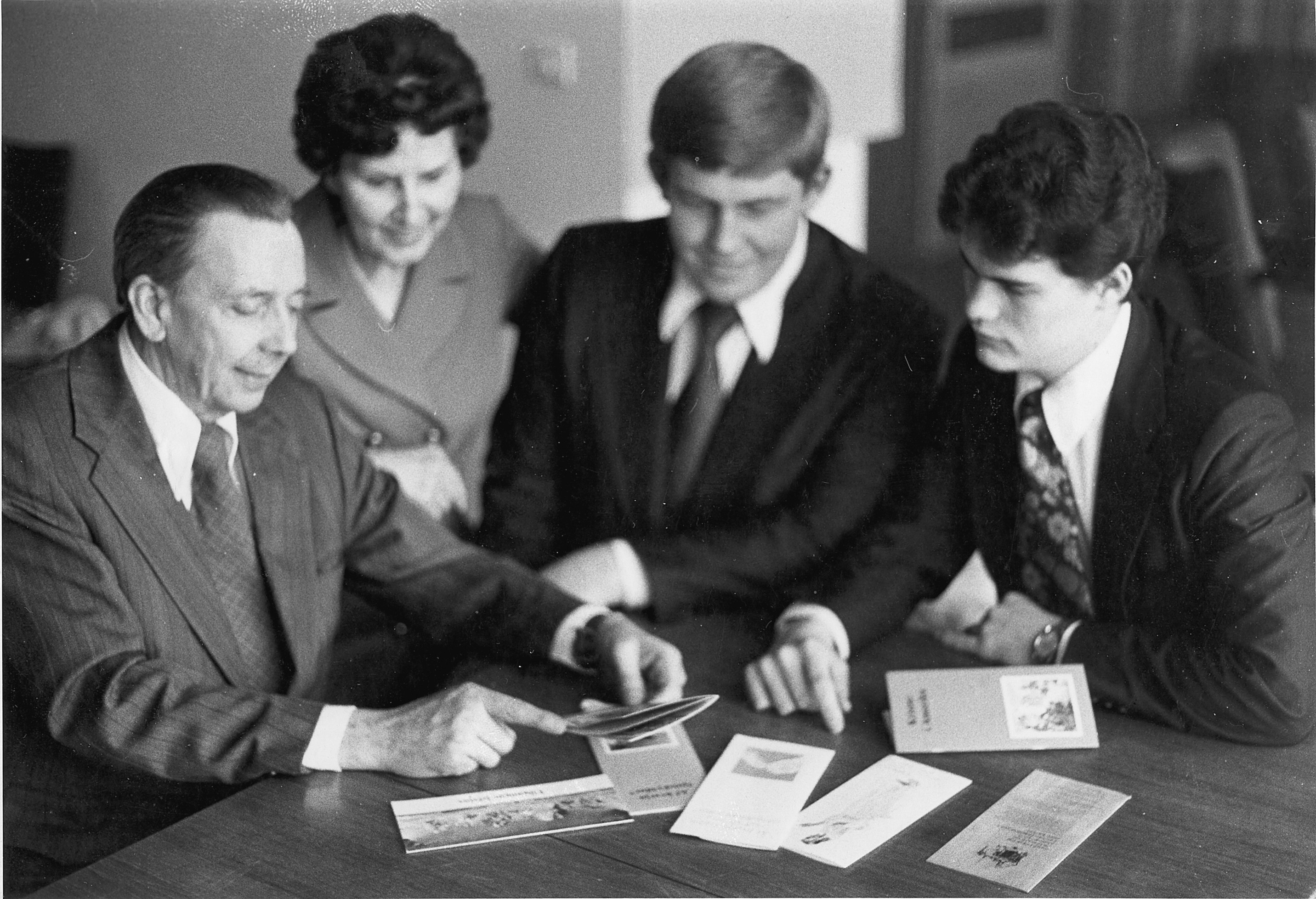Byron and Melva Geslison, David Dedrickson, and Ty Erickson  look at newly translated Icelandic missionary tracts, 1977.  Courtesy of the Geslison family