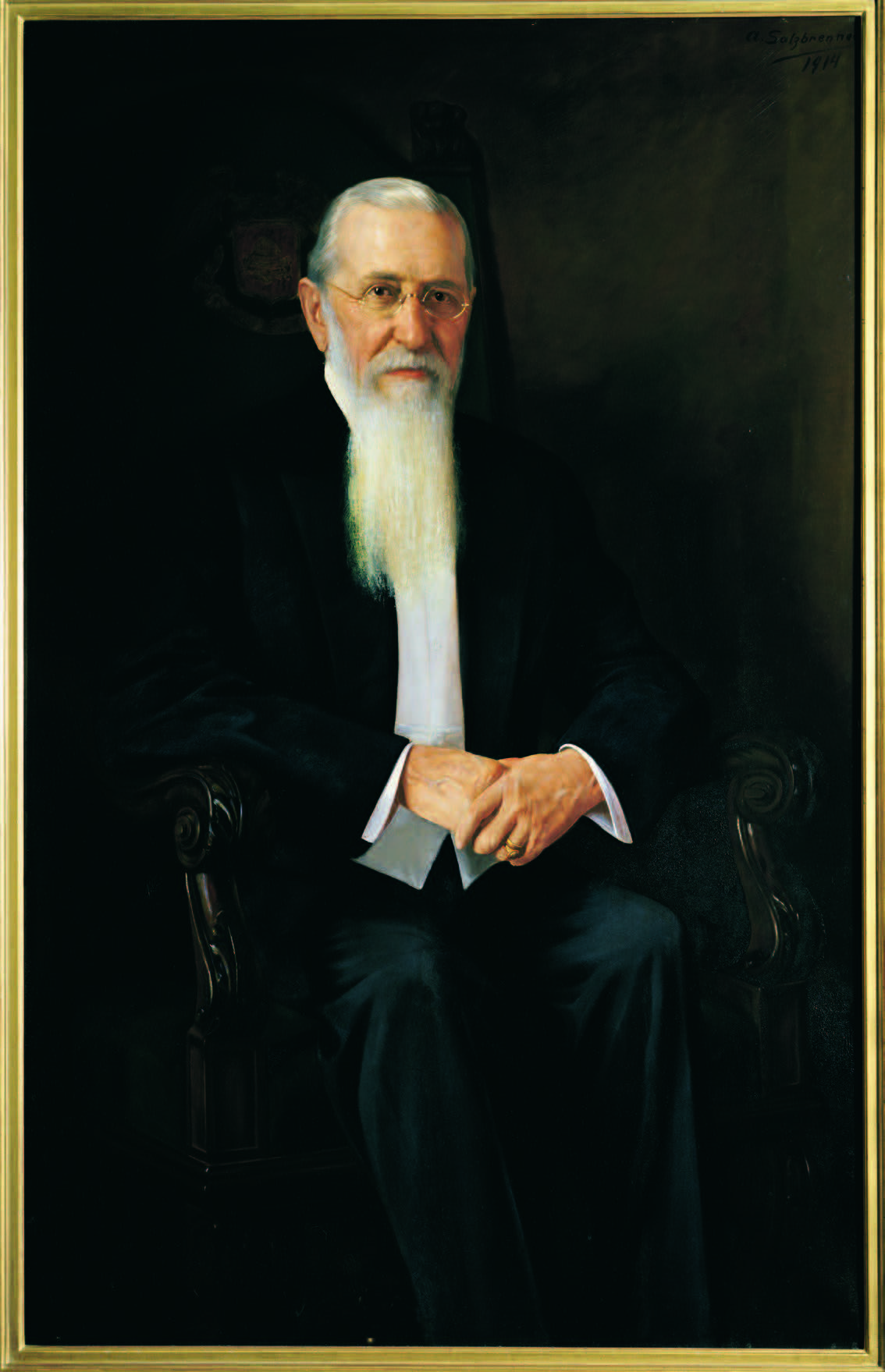 portrait of a man sitting in a chair