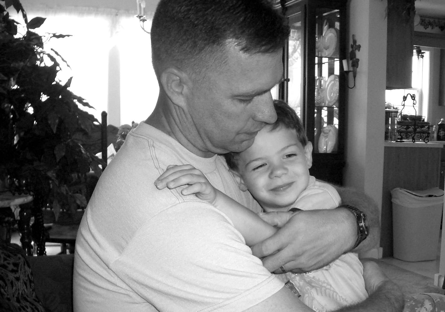 Jon Petty receives a last hug from his son Ryan prior to deploying to Afghanistan. Courtesy of Jon Petty.