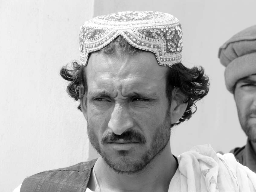 Afghan men wear several different distinctive kinds of headdresses depending on their ethnic affiliation and location. Courtesy of J. Joseph DuWors.