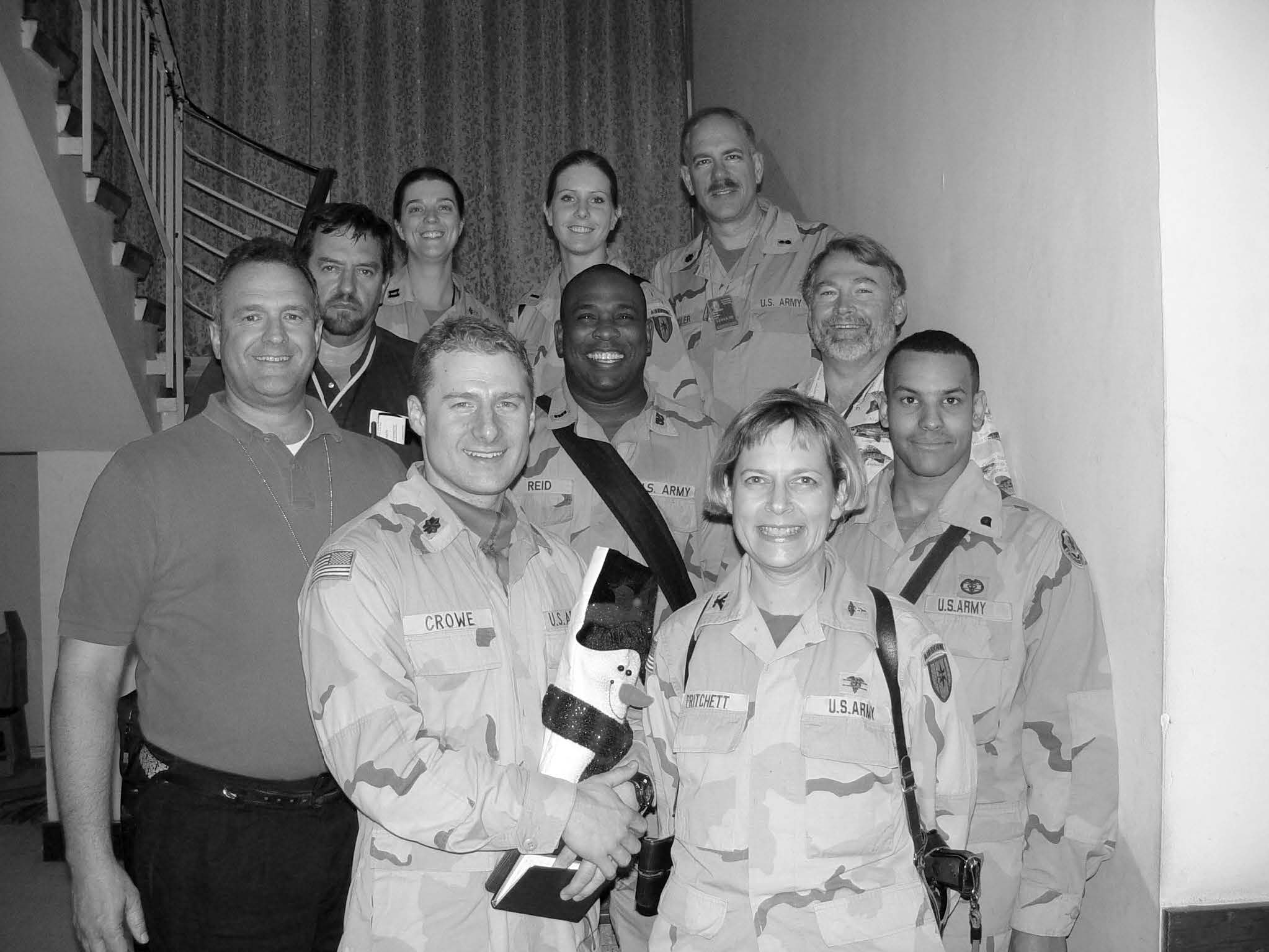 Lieutenant Colonel Kevin R. Riedler (right, back row) caroling with a group of Latter-day Saint soldiers in Baghdad on Christmas Day in 2003. Courtesy of Kevin R. Riedler.
