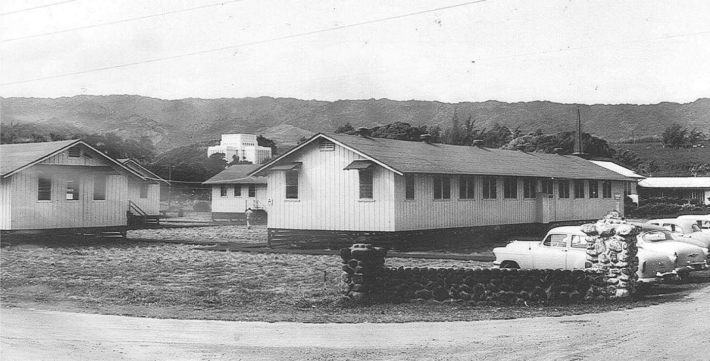 With the addition of several war-surplus buildings and use of the Lāʻie Chapel and other nearby buildings, a temporary college campus (1955–58) came to life near the temple. Courtesy of BYU–Hawaii Archives.