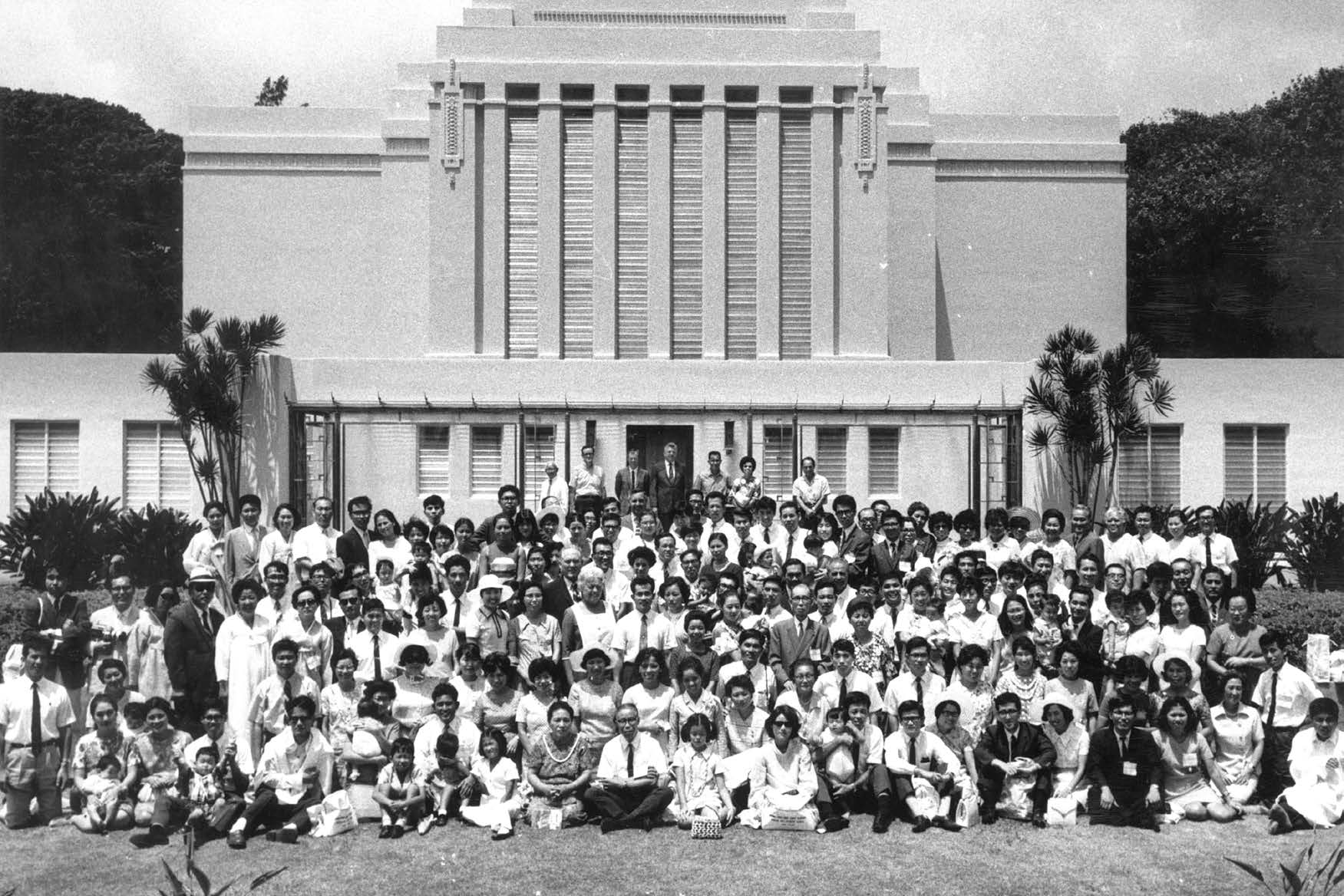 Korean and Japanese Saints in front of the Hawaii Temple in 1970. That year just over a dozen Korean Saints traveled to the Hawaii Temple and connected en route with Japanese Saints making the same trip. Courtesy of BYU–Hawaii Archives.