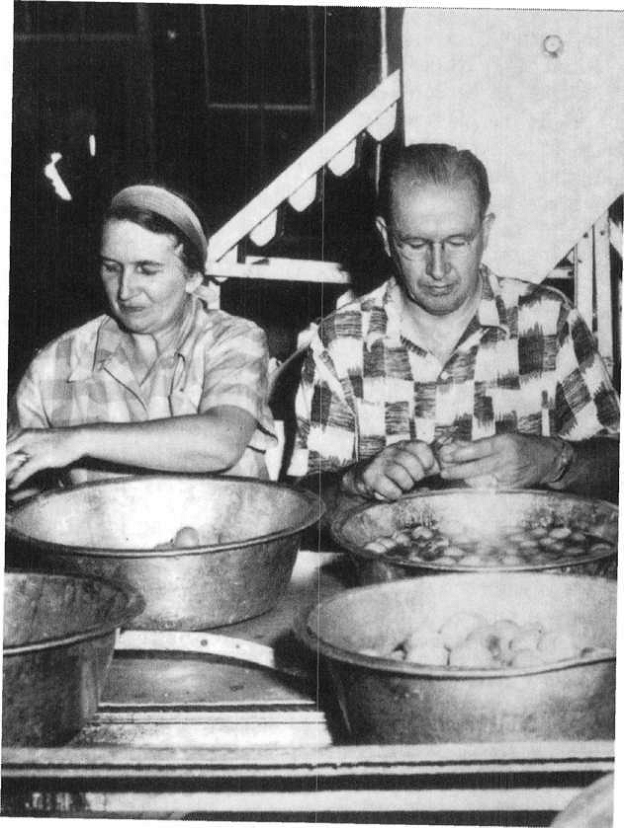 Elder Ezra Taft Benson and his wife, Flora Benson, at a welfare cannery