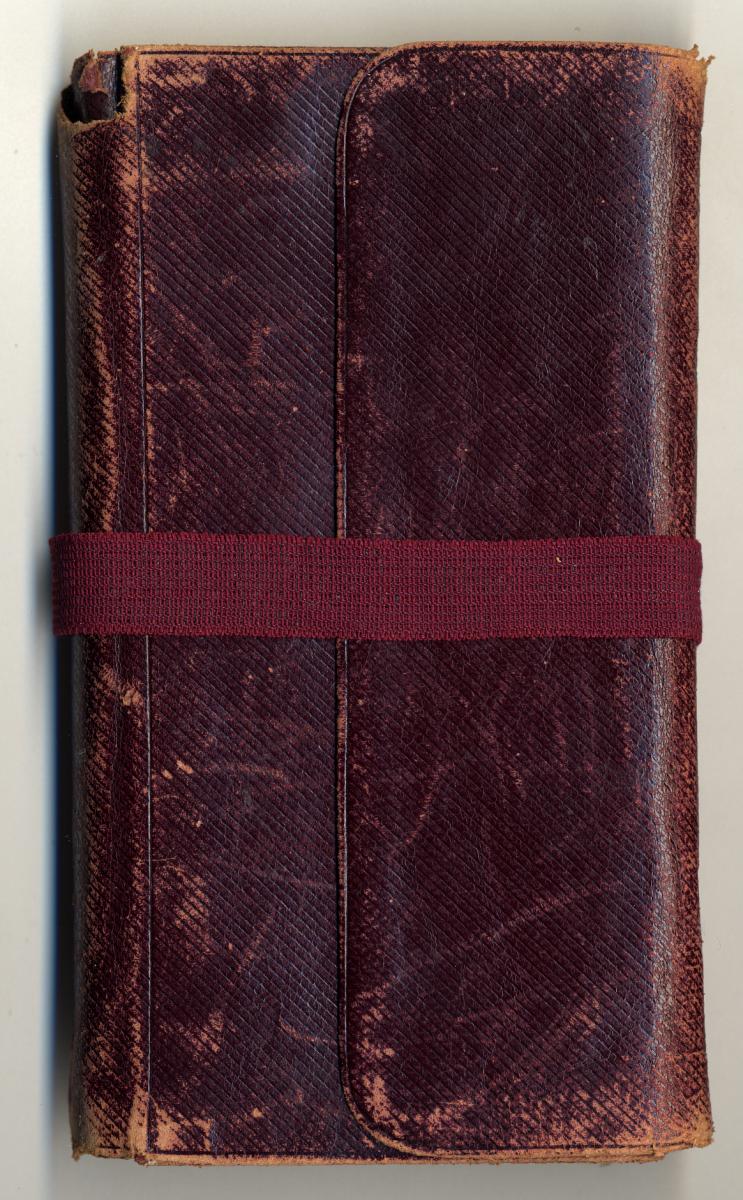 Adolf Haag’s first mission journal, with a red-brown leather cover and a flap that folds over and is inserted into a slot to secure the cover. A pencil holder is inside the flap (above).