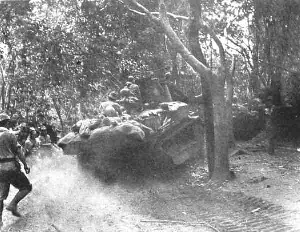 photo of soldiers with a heavily armored japanese tank