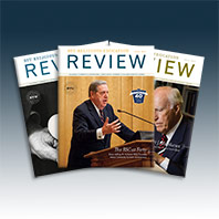 A display of three issues of the Review Magazine