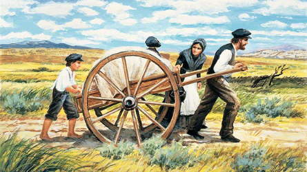 A pioneer family pulling a handcart together
