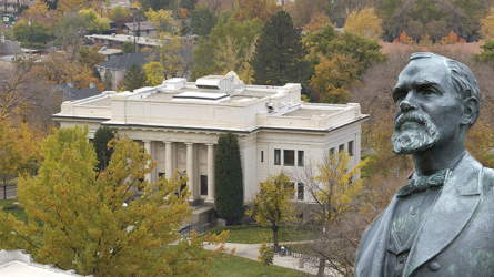Bust of Karl G. Maeser with the BYU building named for him in the background