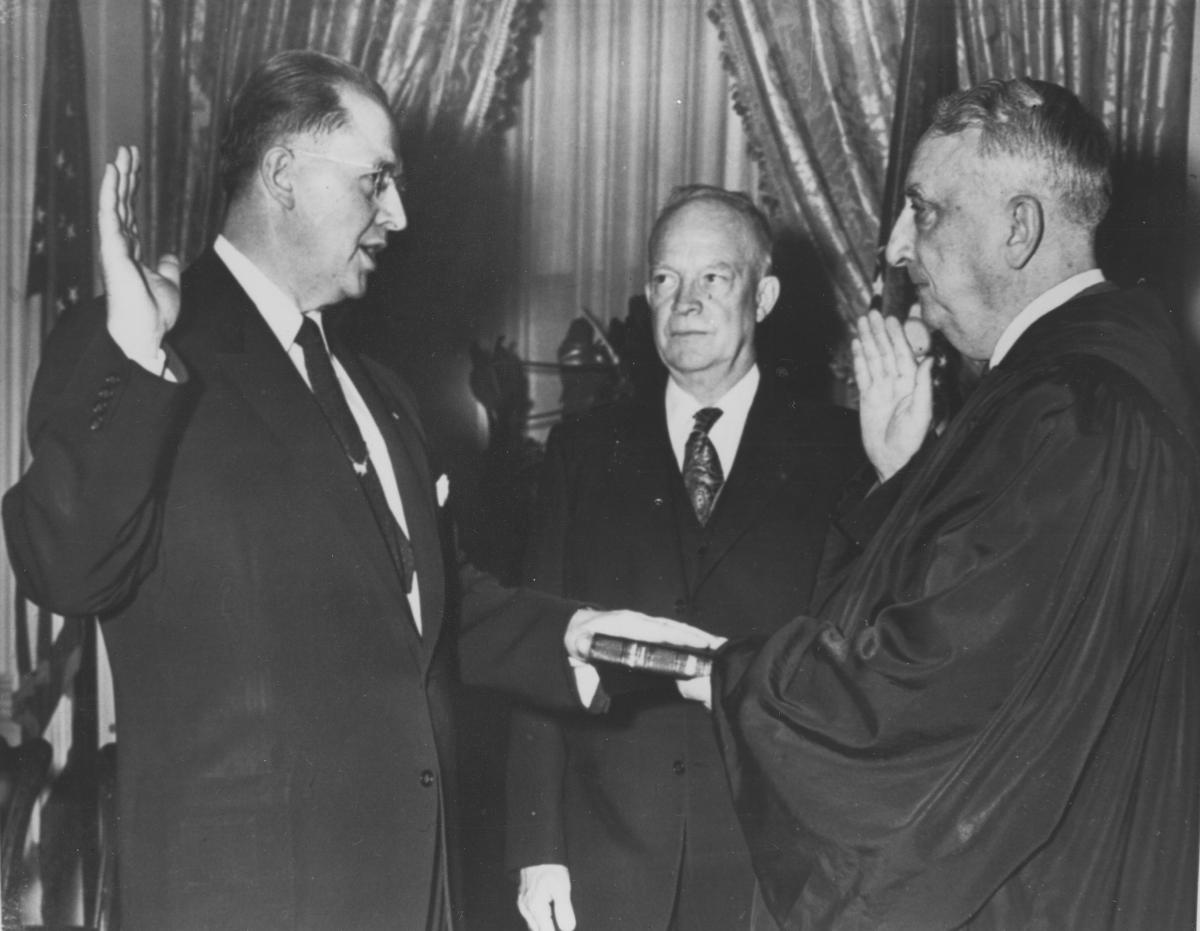 Ezra Taft Benson is sworn in as U.S. secretary of agriculture as President Dwight D. Eisenhower looks on
