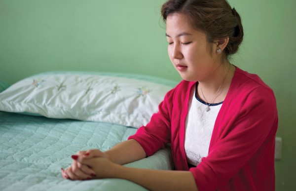 Young woman praying