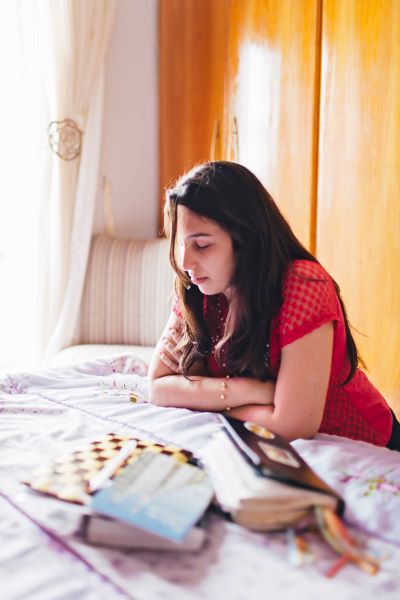 Photo of a young woman praying