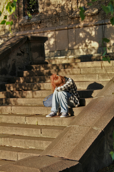 Woman sitting on stairs