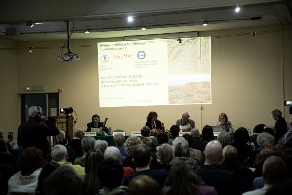 Photo of presenters at a conference