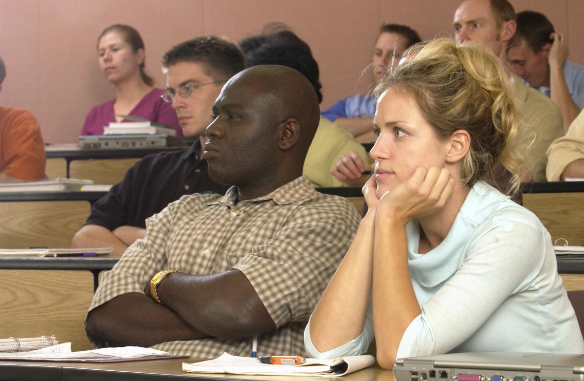 "Students paying attention in lecture hall"