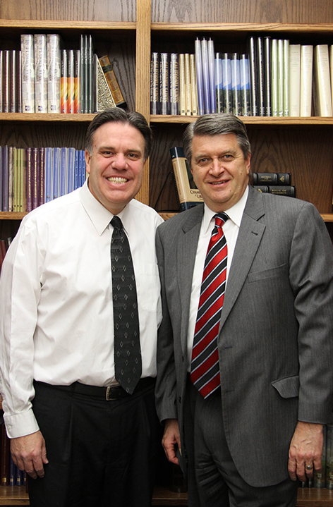 Brent Top and Brad Wilcox standing in the Dean's office