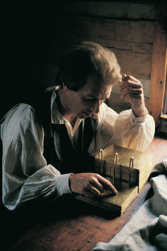 Joseph Smith reviewing the engravings on the gold plates