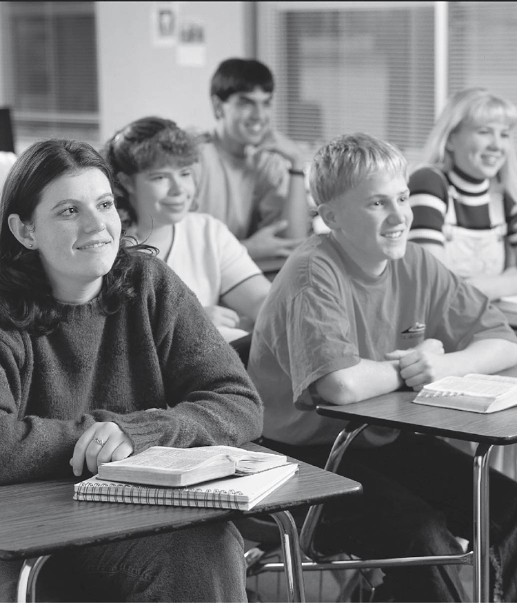 Student sitting at their desks in a Seminary Class