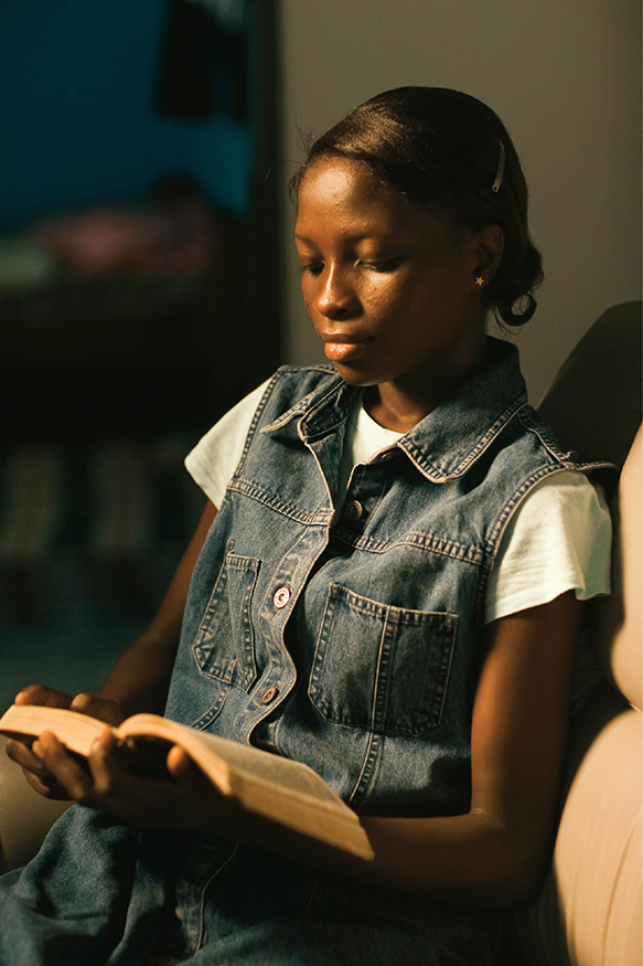 Young girl reading the scriptures