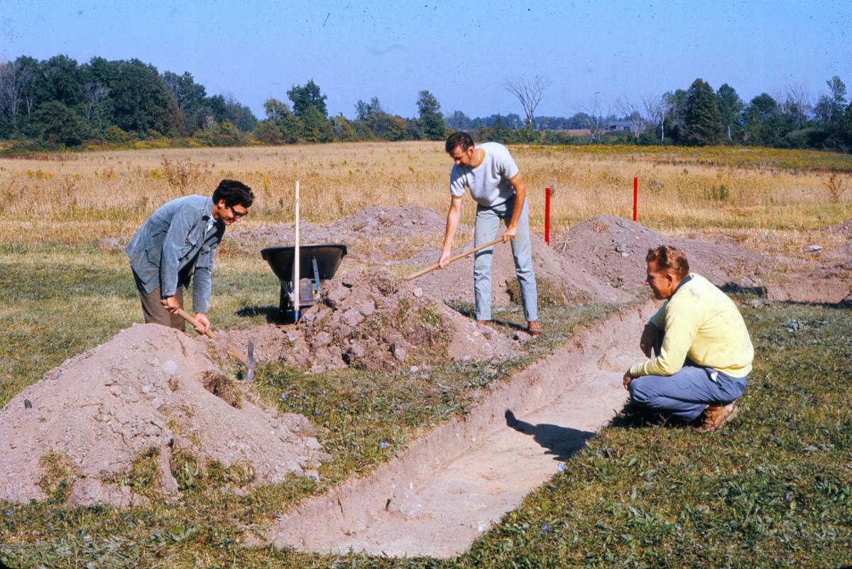 3 men digging initial test trench