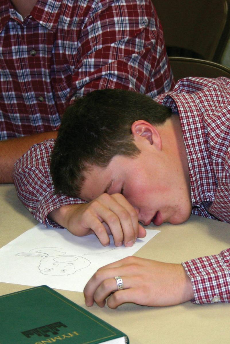 Boy sleeping in class