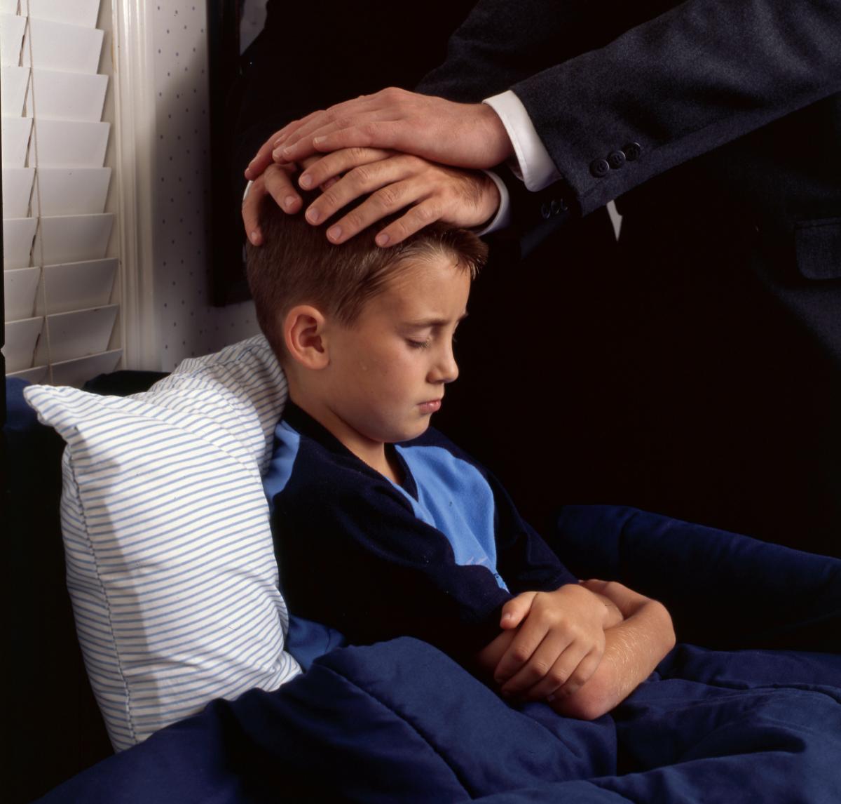 Little boy receiving a priesthood blessing