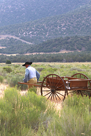 man pulling a handcart