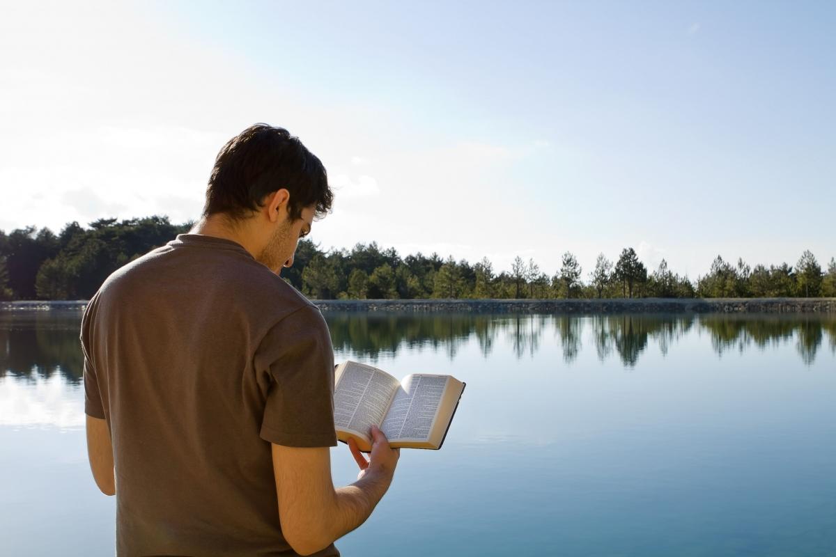 Young man reading the scriptures