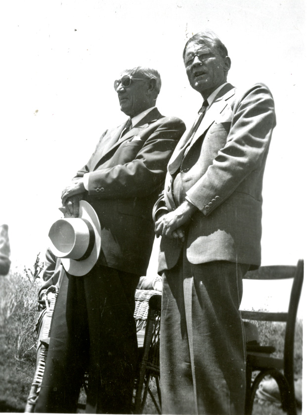 President W. Ernest Young translates for Elder Richards at the baptismal service. Courtesy of John R. Wall