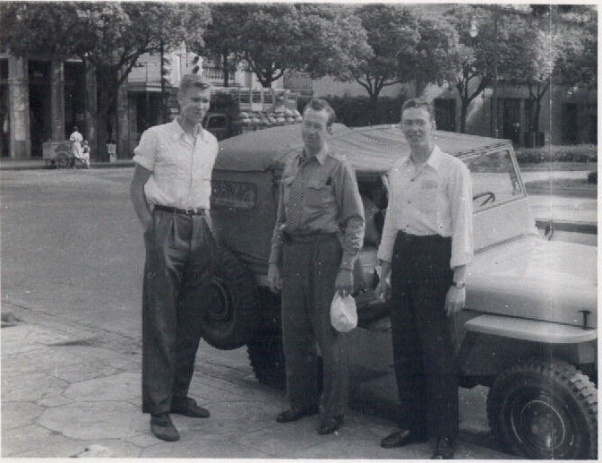 Elder Pinegar, President Harold Rex, and Elmo Turner standing in front of the mission jeep. Courtesy of CHL
