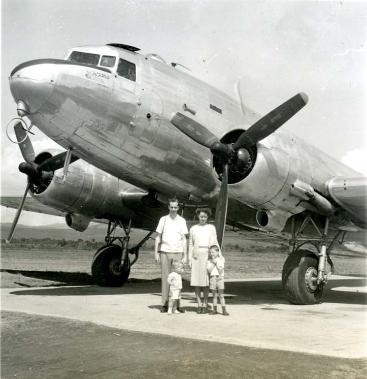 The Rex family standing in front of a DC-3 airplane. The Richardses’ first flight was on a DC-3 airplane in brazil. Courtesy of CHL.
