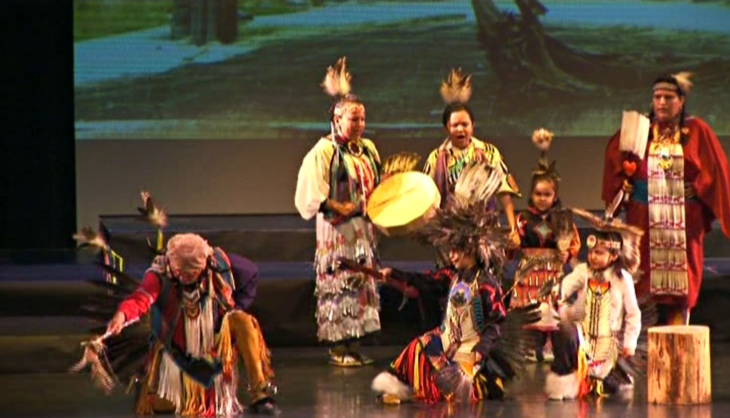 A family dressed as Native Americans