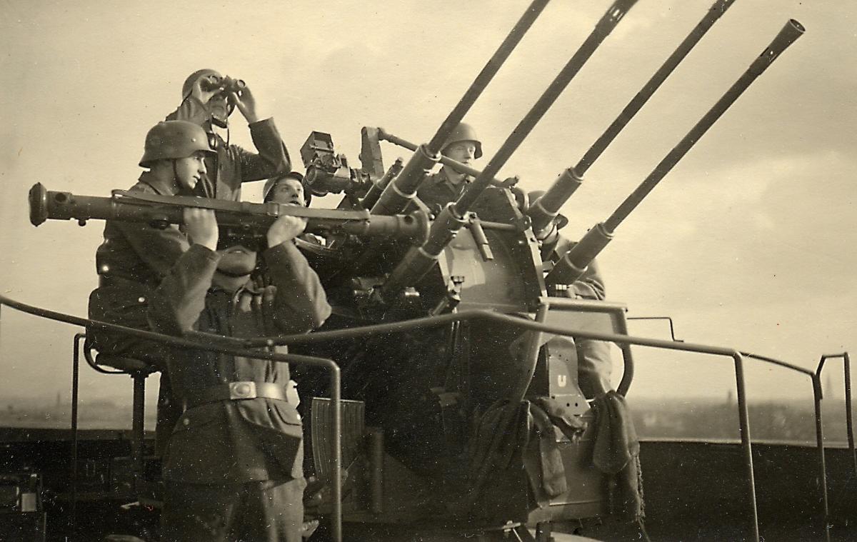 men around antiaircraft battery