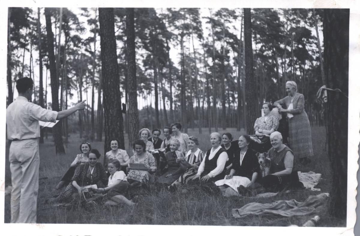 people singing hymn in woods