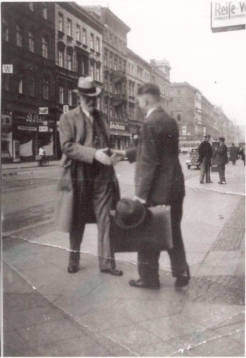 Richard Deus about to shake hands with Church President Heber J. Grant on street