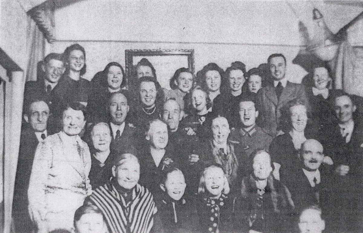 A group of Saints met in the Nolte home at Christmastime