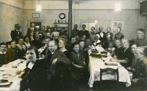 picture of people gathered around dining tables