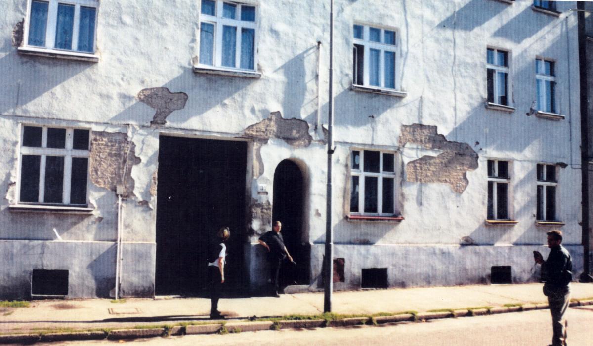 Walter Kindt standing at the entry to the wartime church meeting rooms