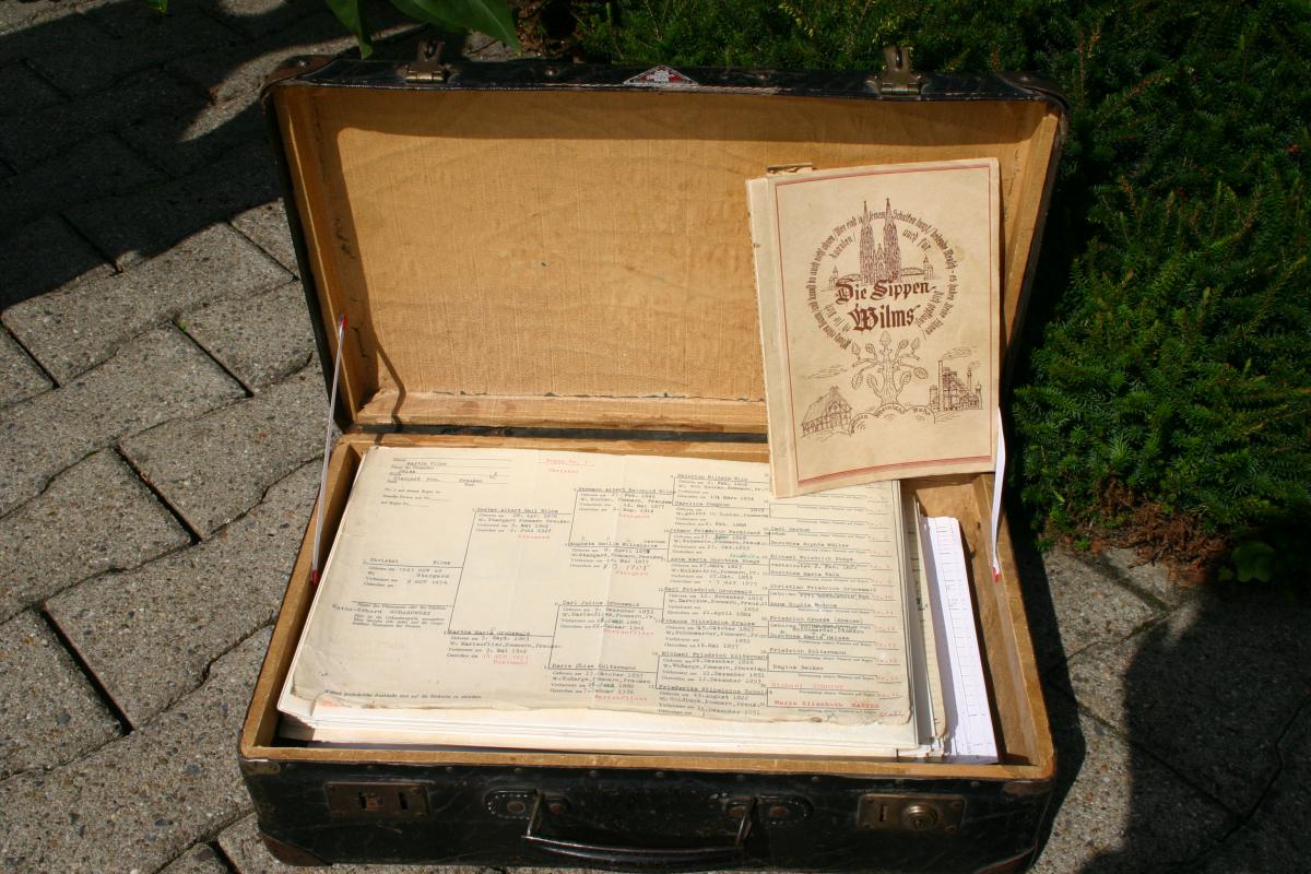 small open suitcase with documents inside