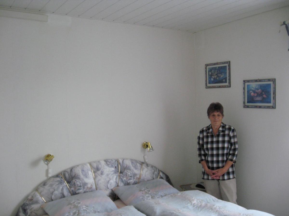 Jutta Damm Sedlacek standing in bedroom