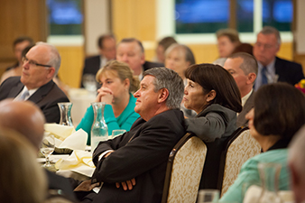 People sitting at a table listening