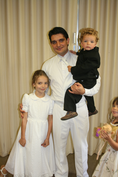 Clothed for the baptism, occasion for a ritual photo (Arnhem, Netherlands, 2011.)