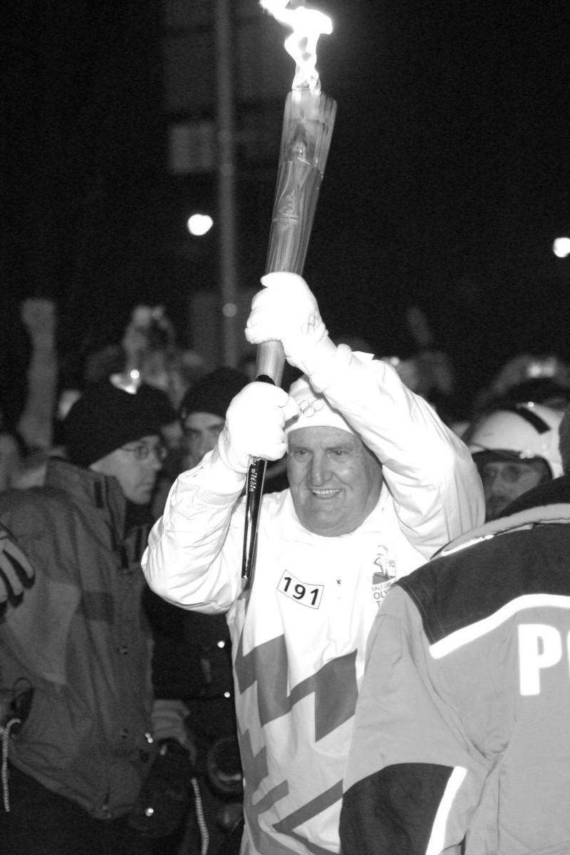 LaVell Edwards carrying the Olympic torch