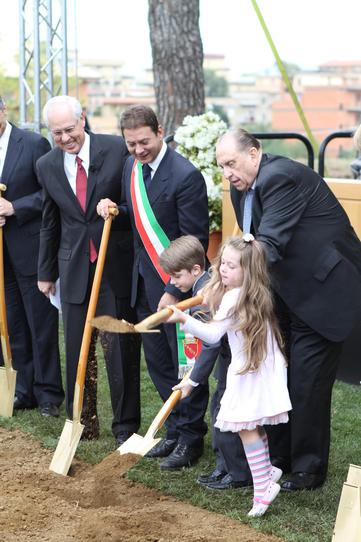 kids and president monson participating in a ground breaking