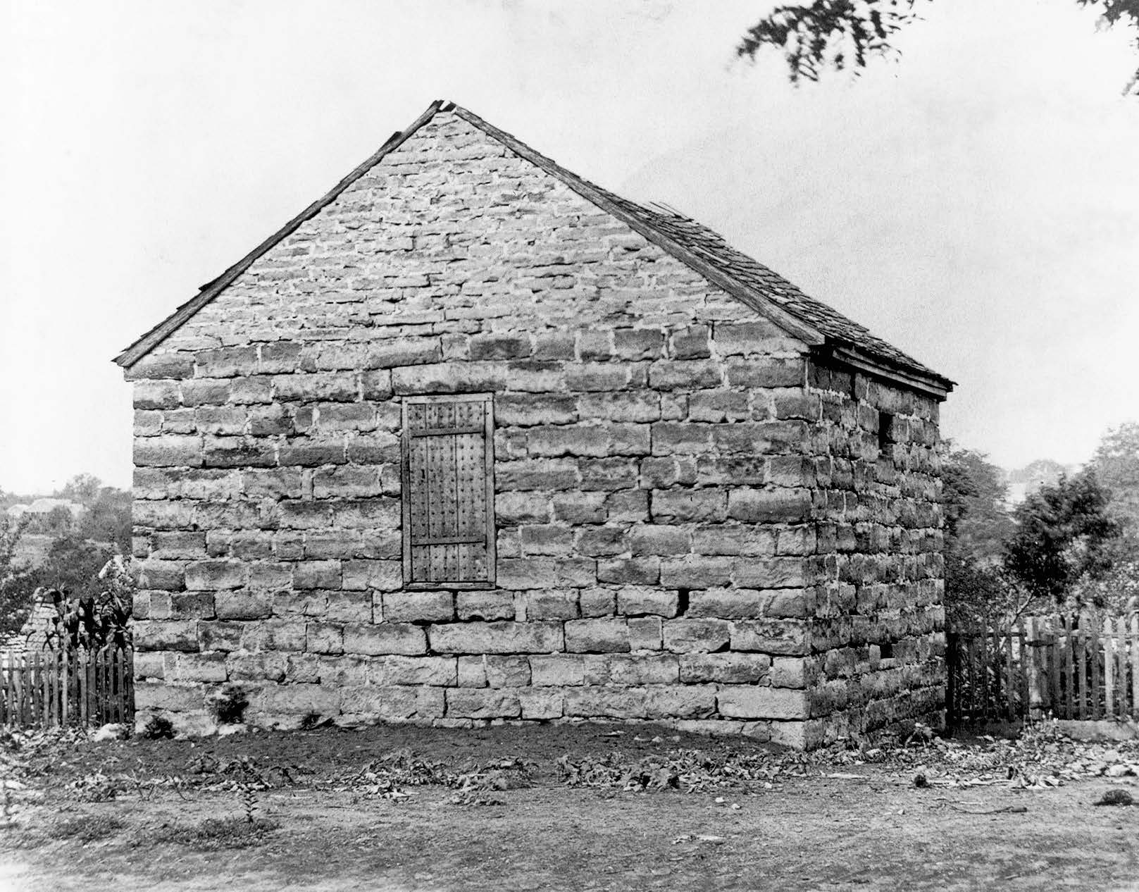 Clay County (Liberty) jail in Liberty, Missouri, where Joseph Smith, Hyrum Smith, Alexander McRae, Sidney Rigdon, and Caleb Baldwin were held. Courtesy of Church History Library.