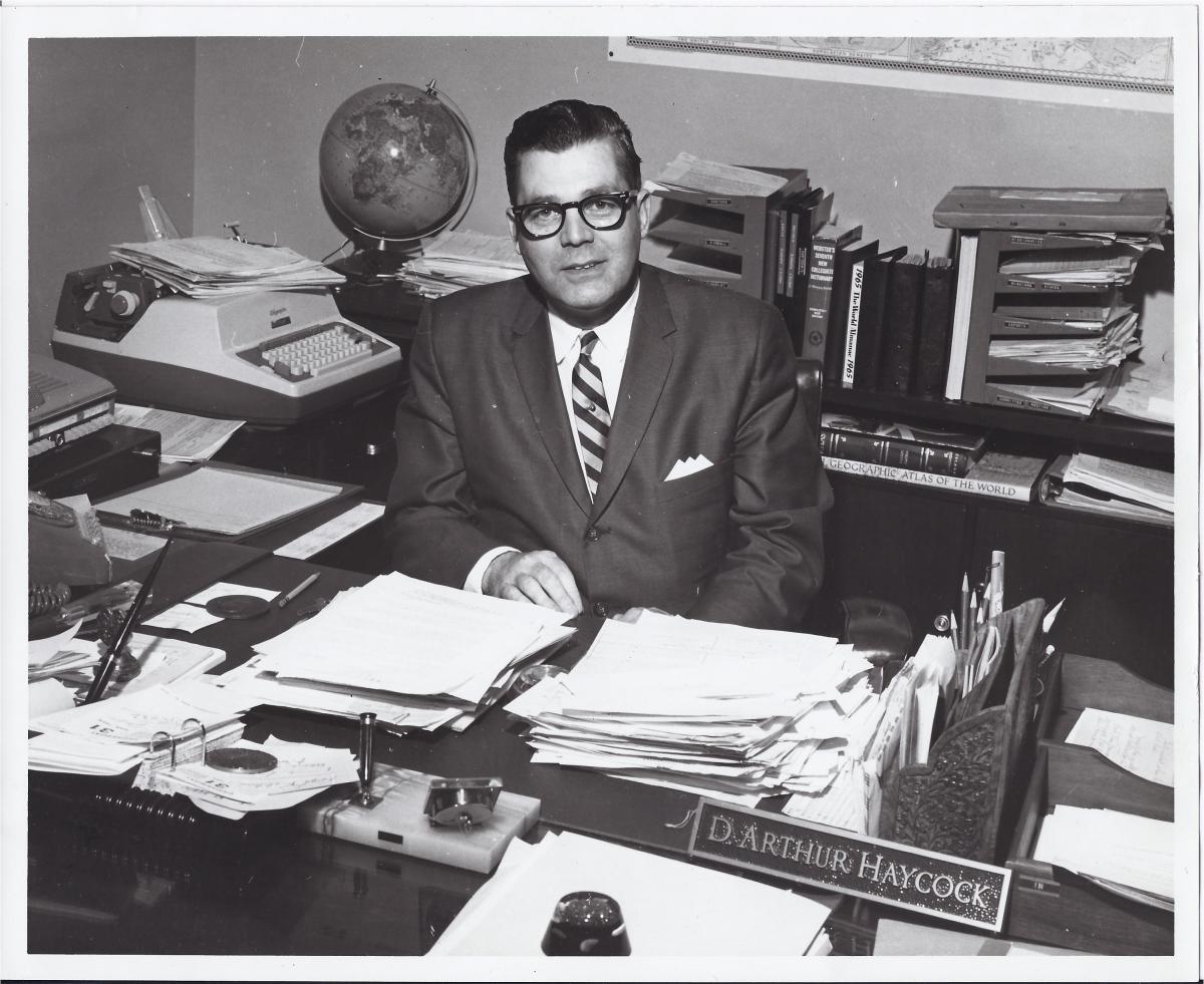 Photo of Arthur Haycock at his desk