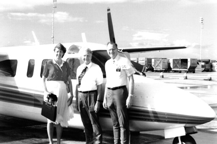 Left to right: Darnell Jeffs, Frank Talley, and President Dean Jeffs in front of Talley's personal airplane.