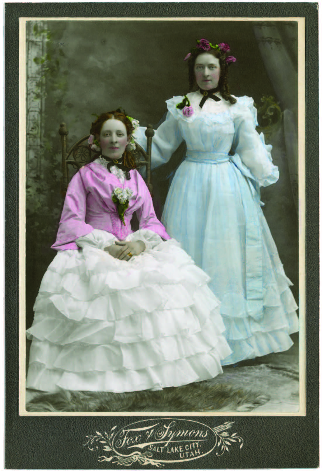 two women in dresses