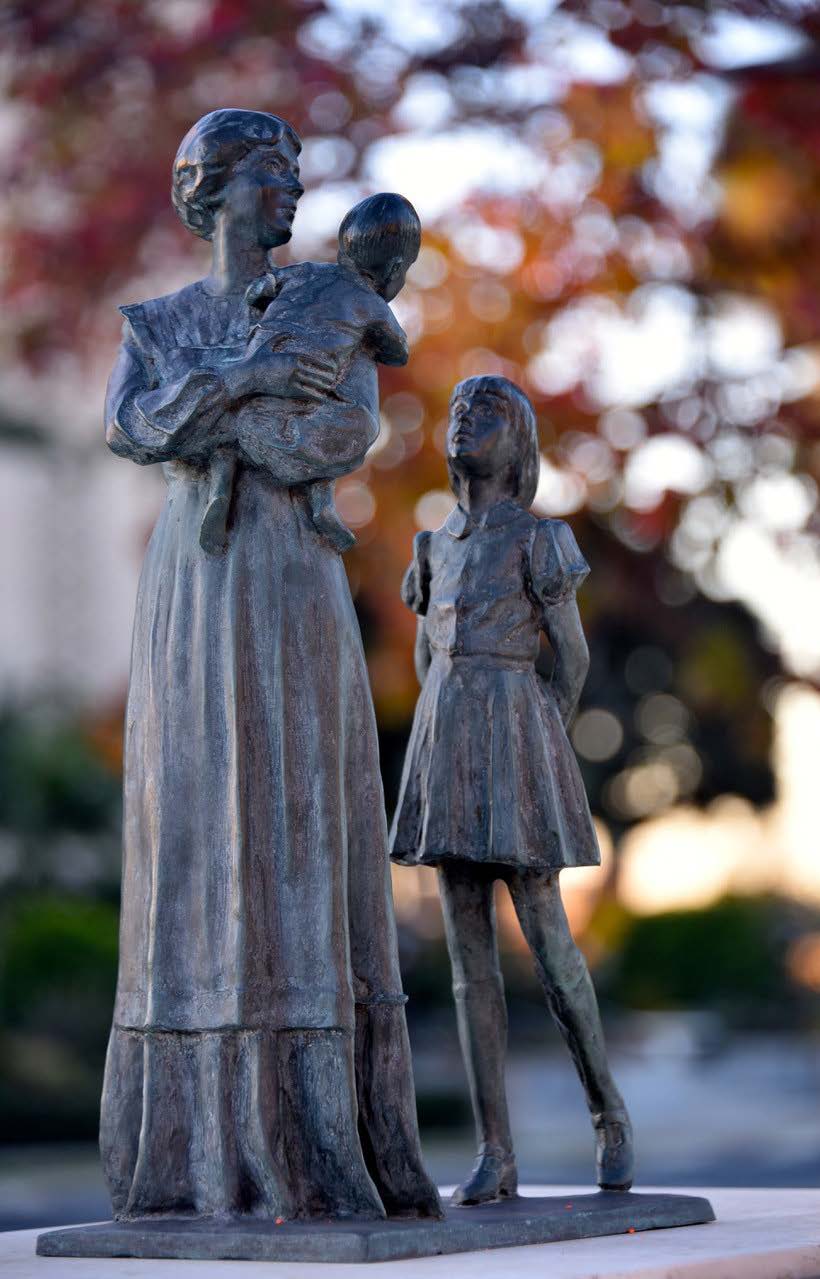 statue of mother with children